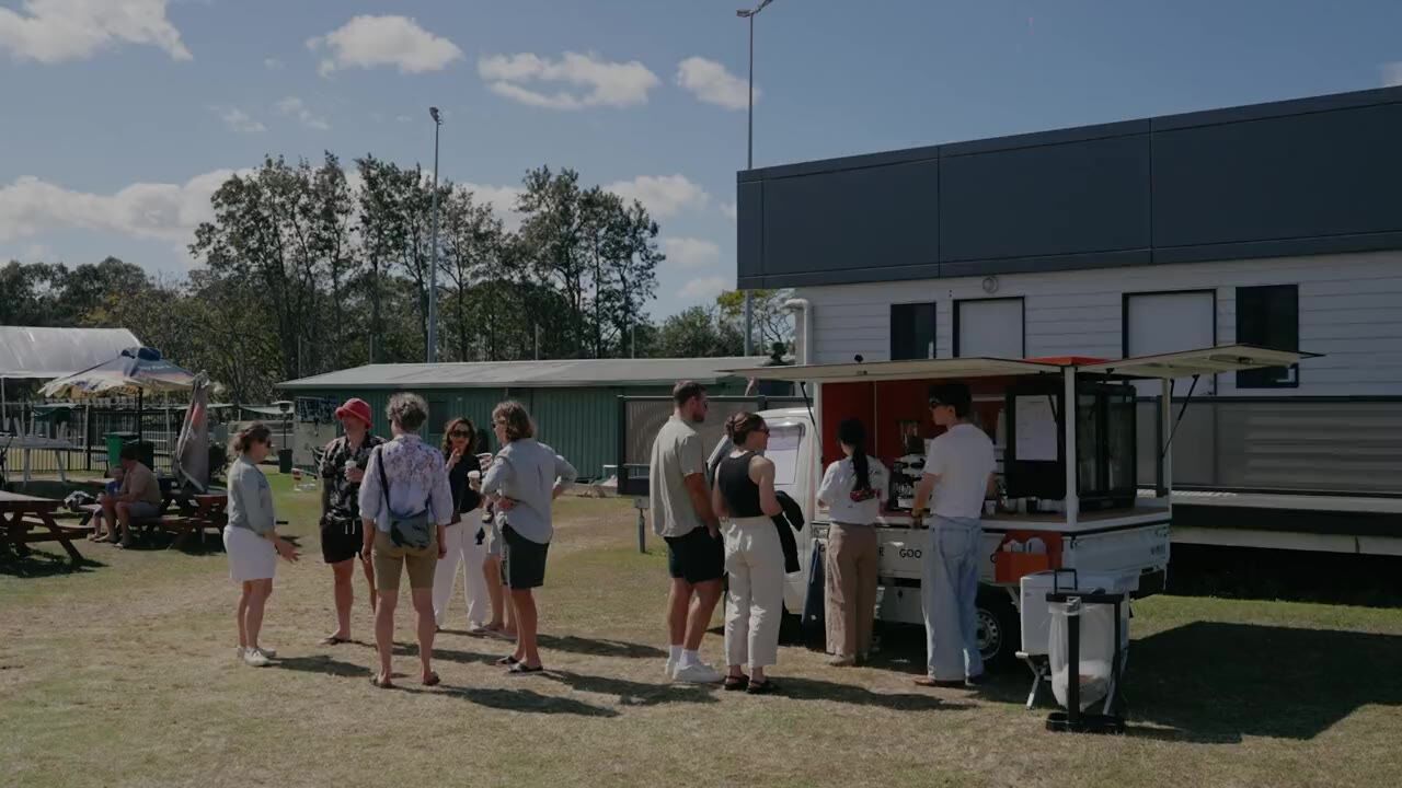 [monomer] coffee truck serving guests at an outdoor event